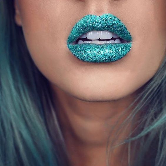 Glitter over aqua blue lipstick