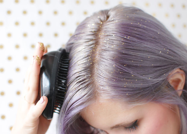 Model distributing glitter through her hair