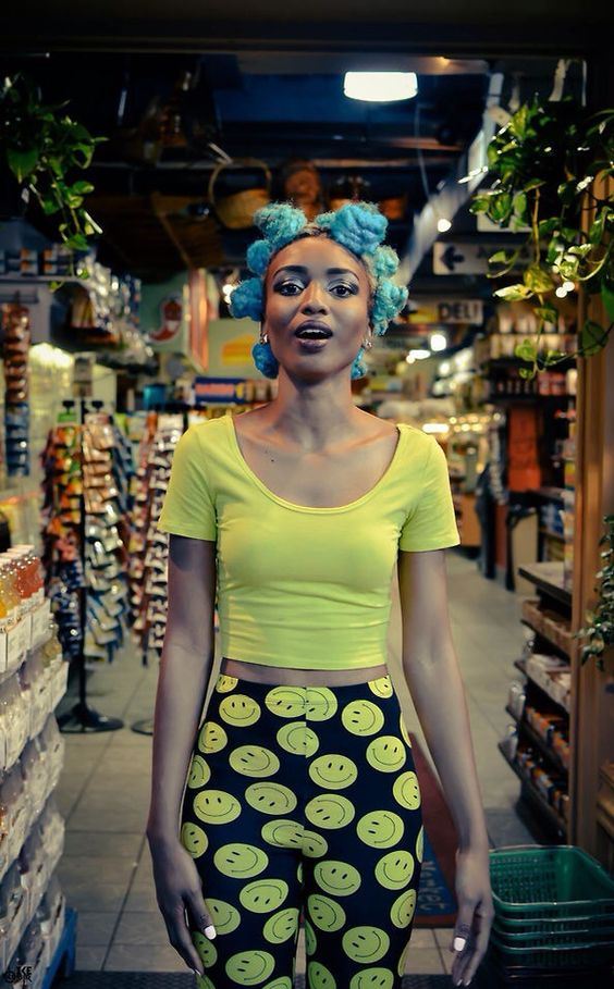 Bantu knots in hair dyed light blue.