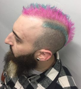 A pink and blue striped short mohawk.