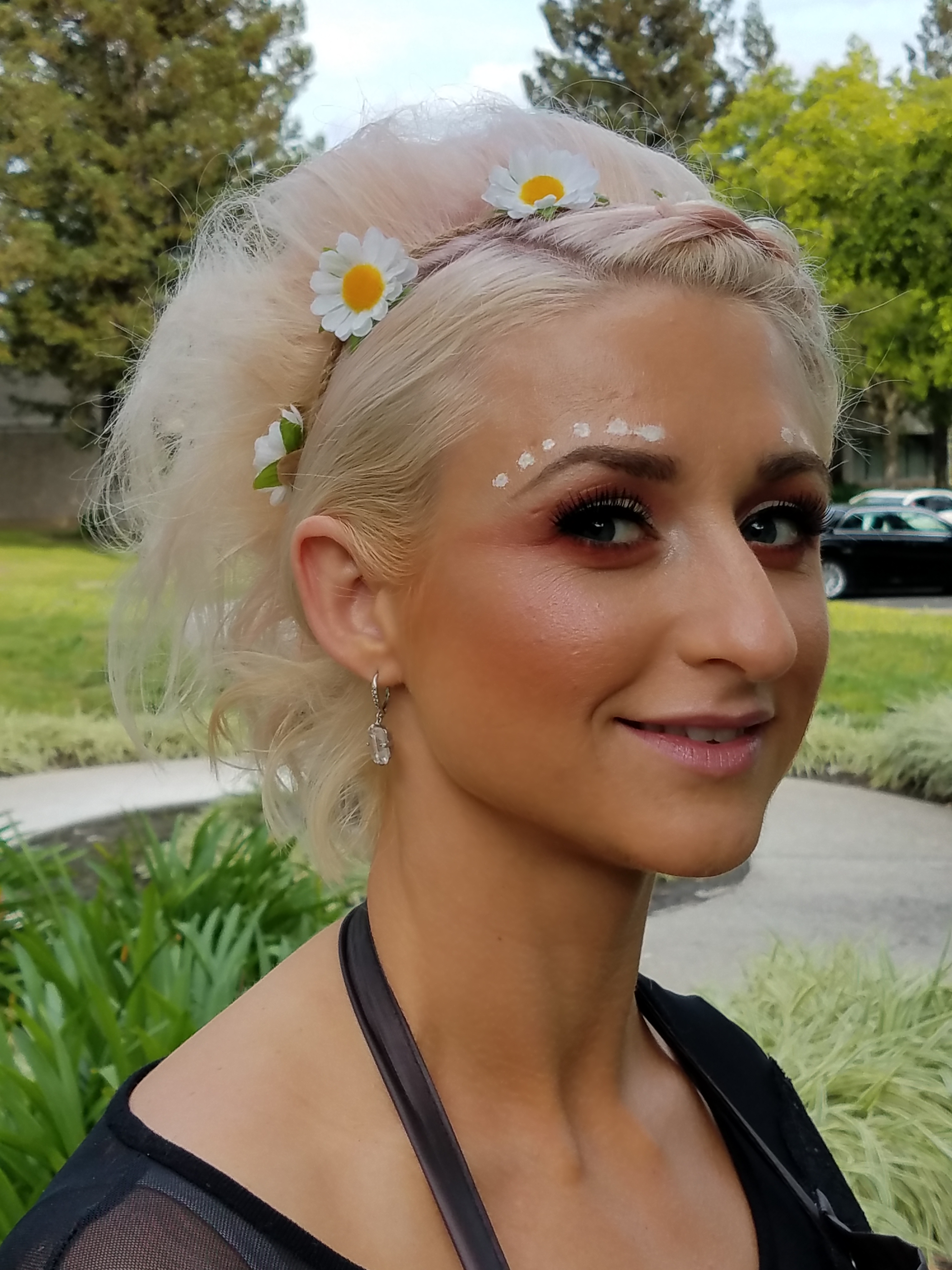 Cute floral headband and eyebrow dots for a festival.